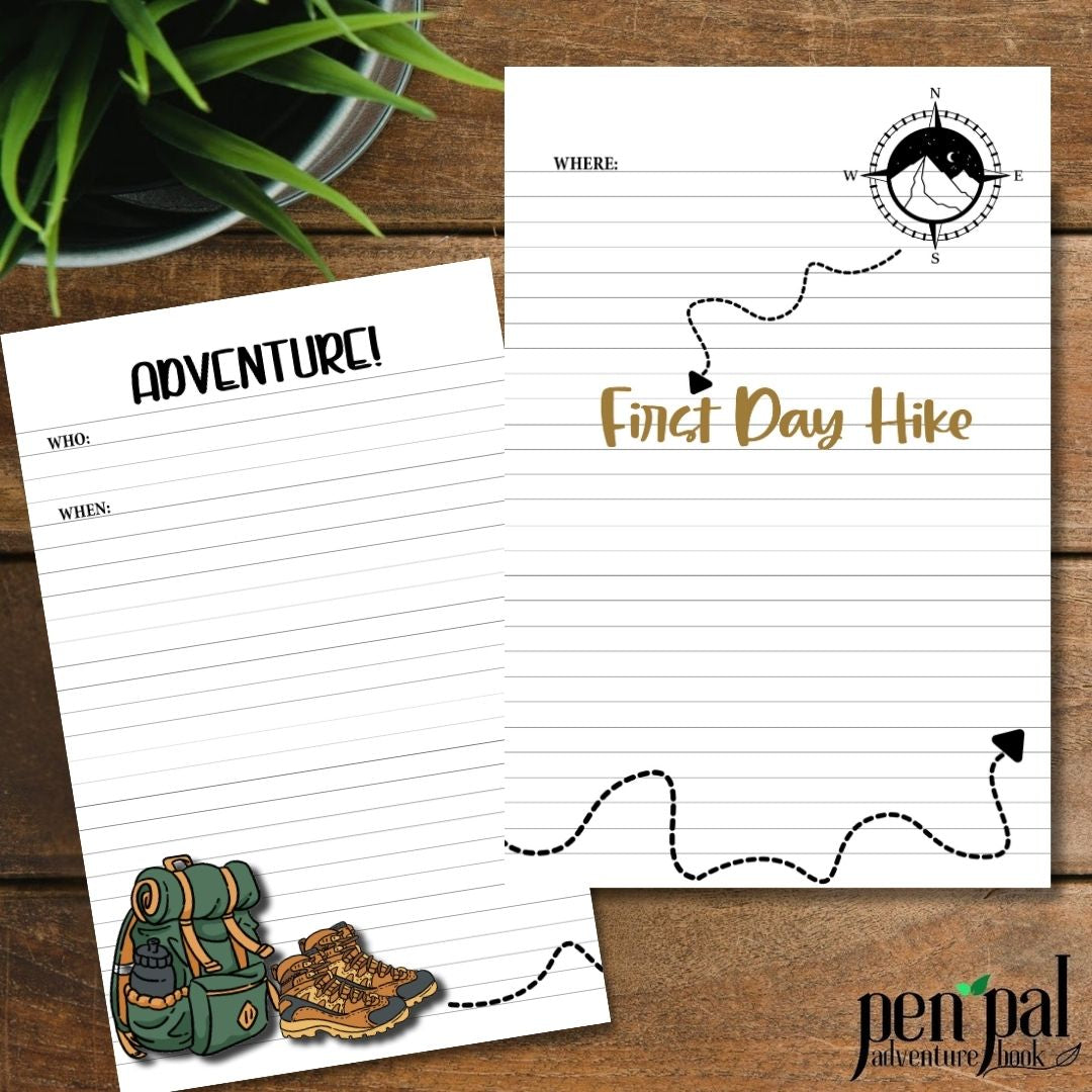 Two sheets of paper with hiking-themed designs on a wooden surface.