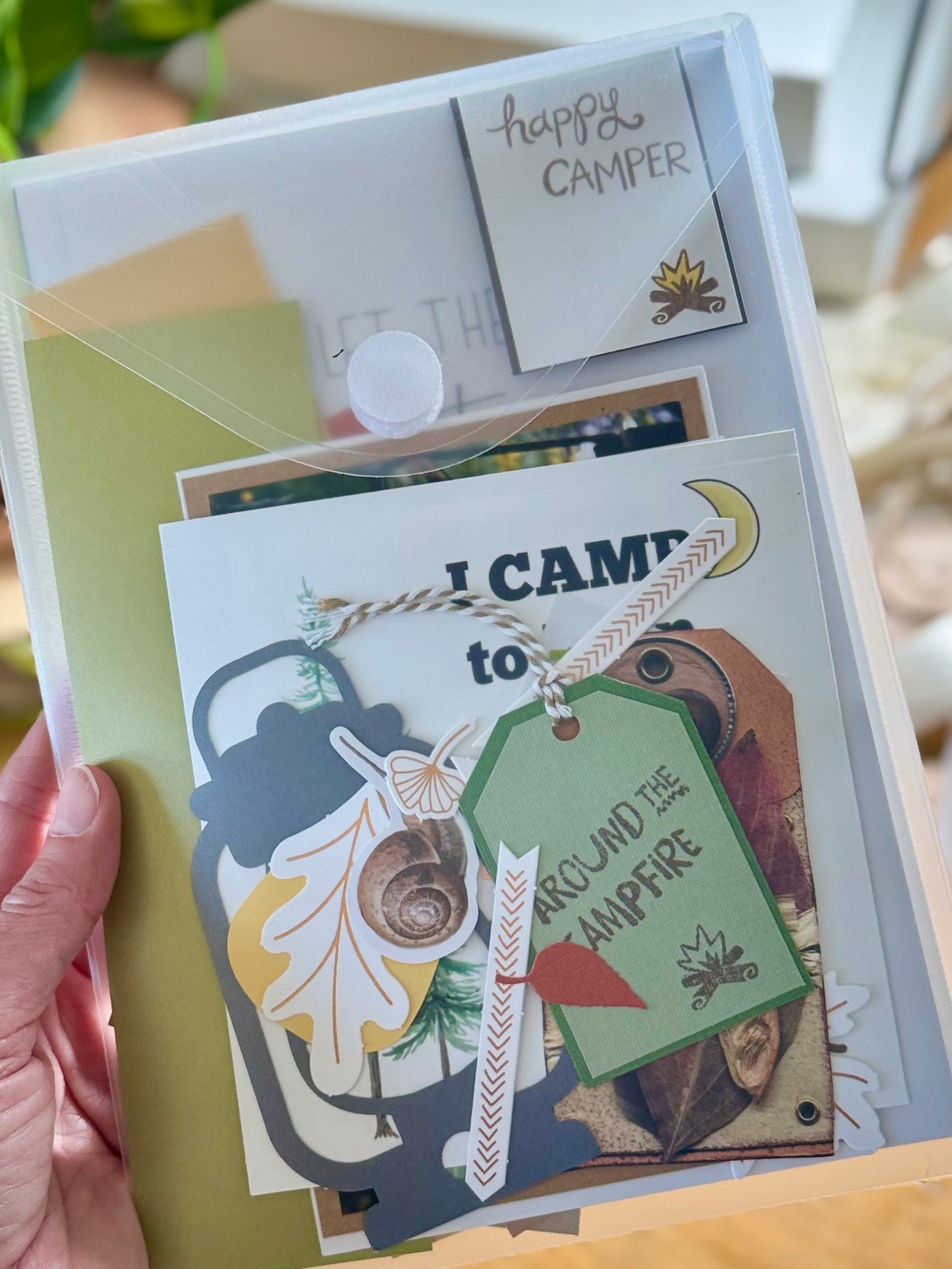 Handmade card with 'Happy Camper' message and camping-themed decorations.