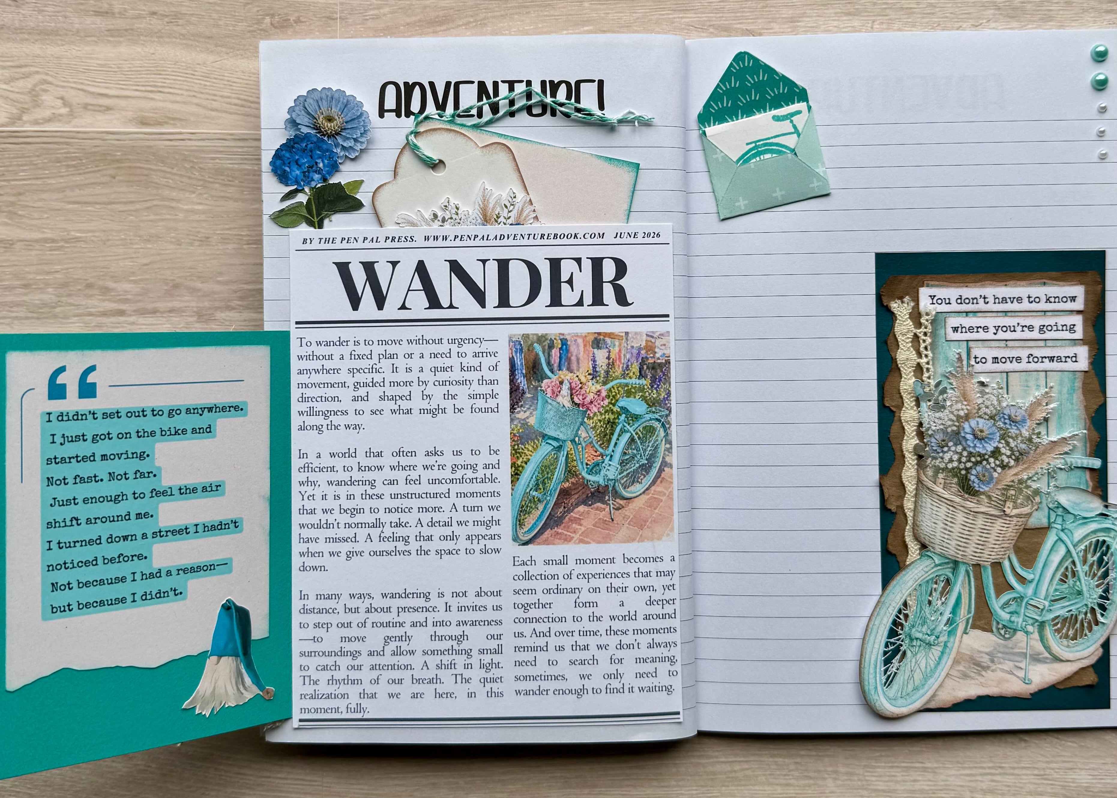 Open notebook with decorative pages on a wooden surface