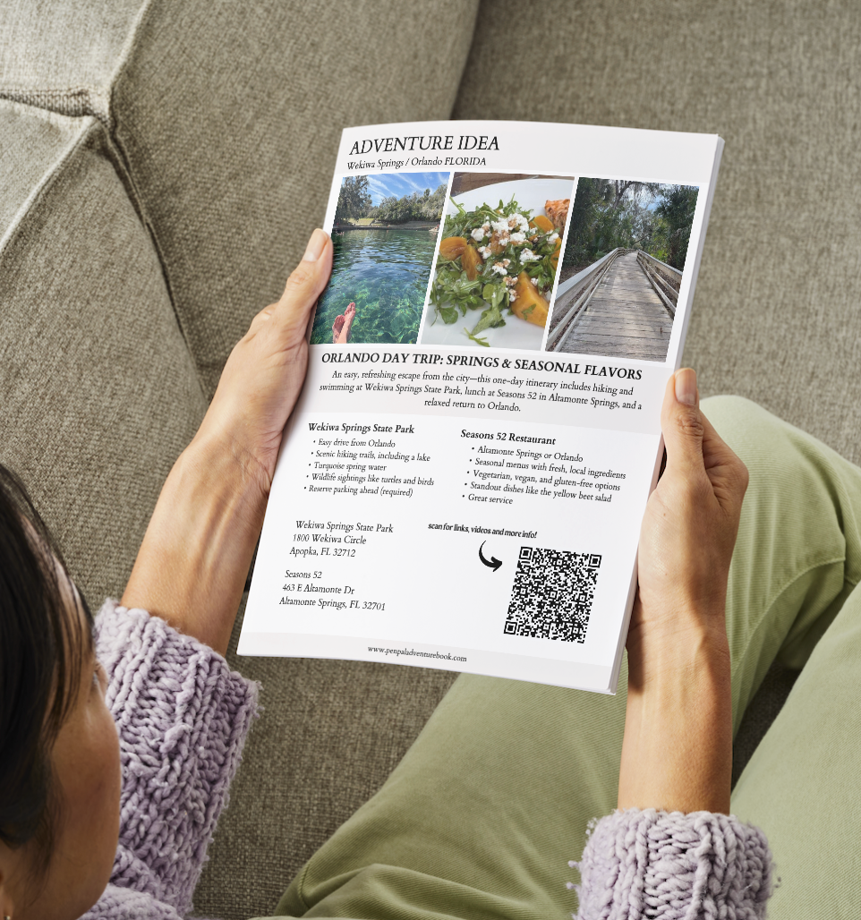 Person holding a flyer with an adventure idea and QR code on a couch.