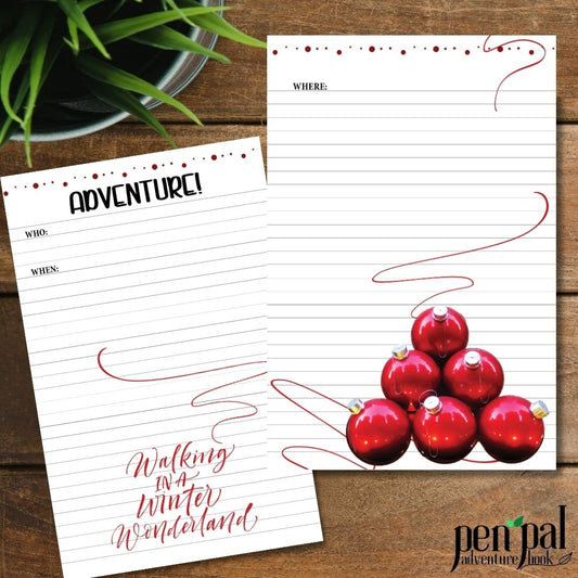 Two sheets of decorative paper with Christmas-themed designs on a wooden surface.